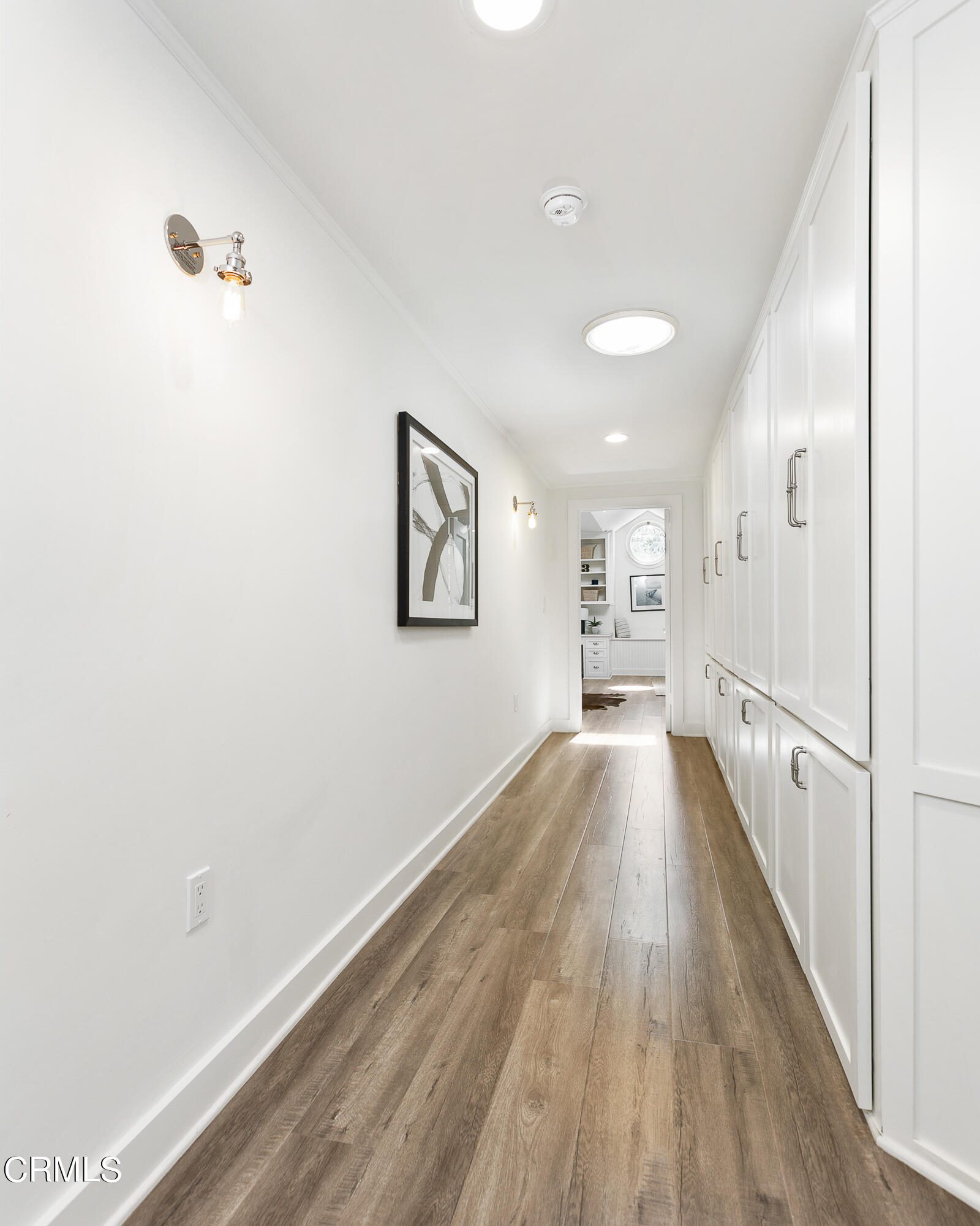 445 Prospect Square Pasadena, CA 91103 - Photo 35 of 55 a view of a hallway with wooden floor and a large window