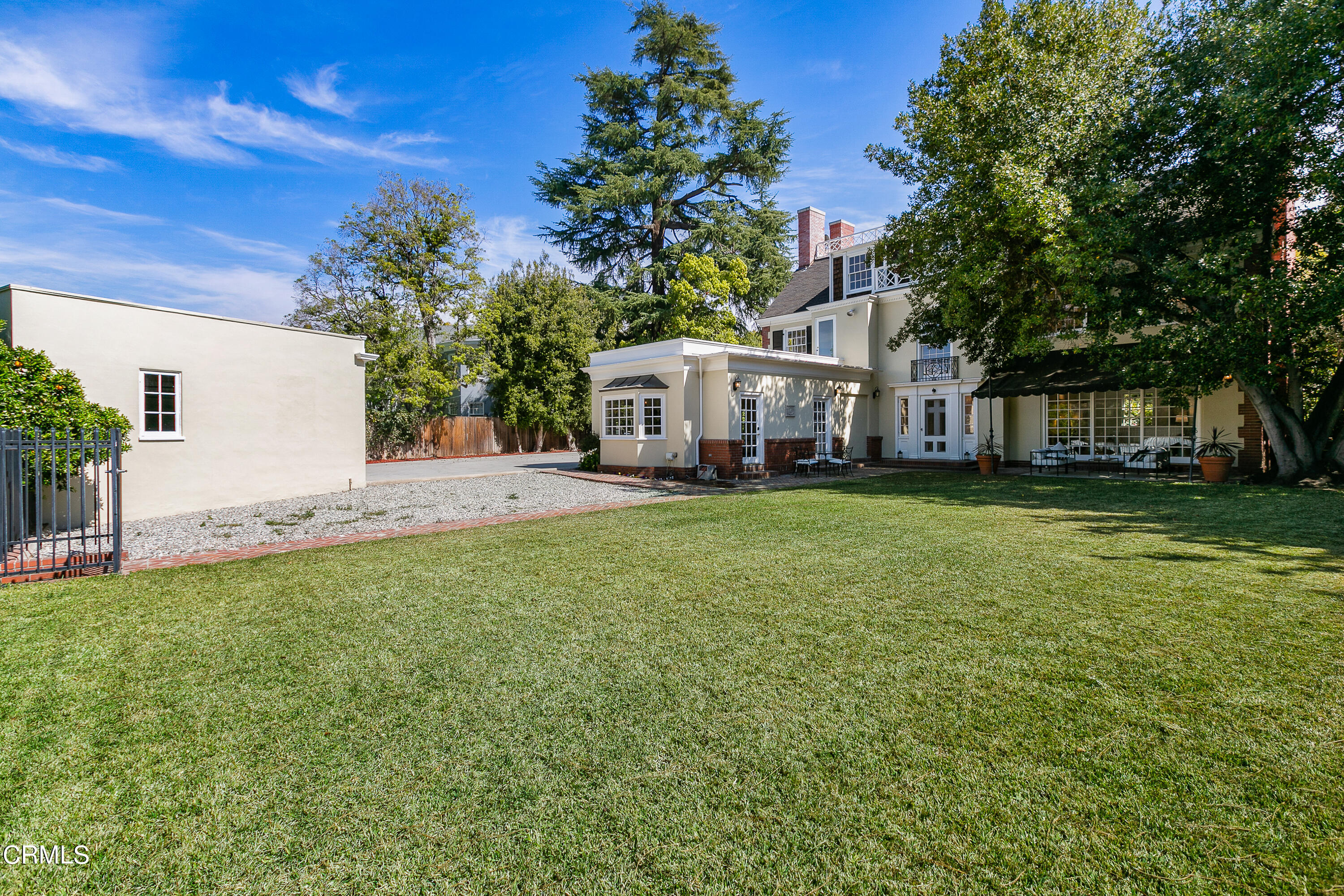 445 Prospect Square Pasadena, CA 91103 - Photo 40 of 55 a front view of a house with a garden and trees