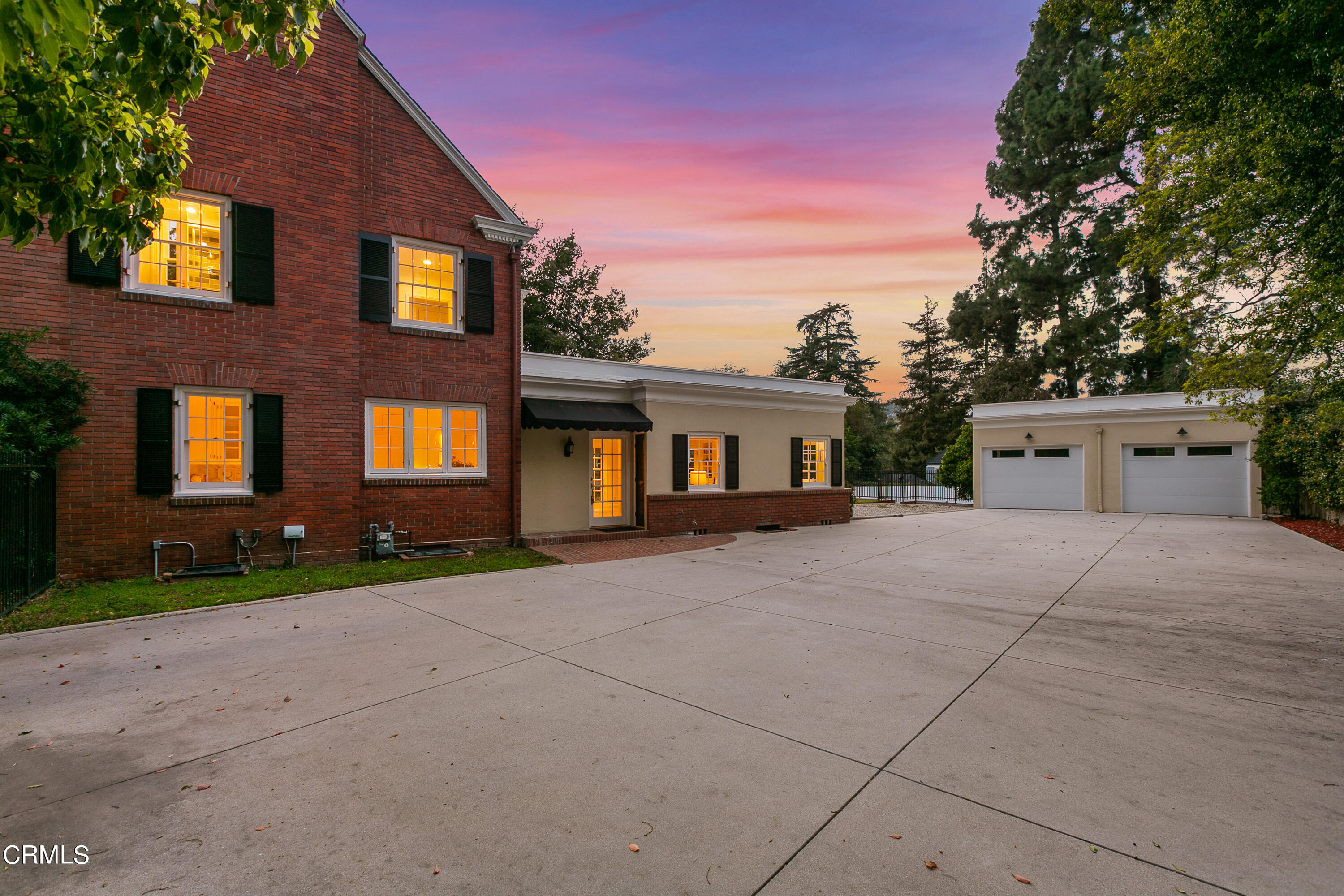 445 Prospect Square Pasadena, CA 91103 - Photo 47 of 55 a front view of a house with a yard and a garage