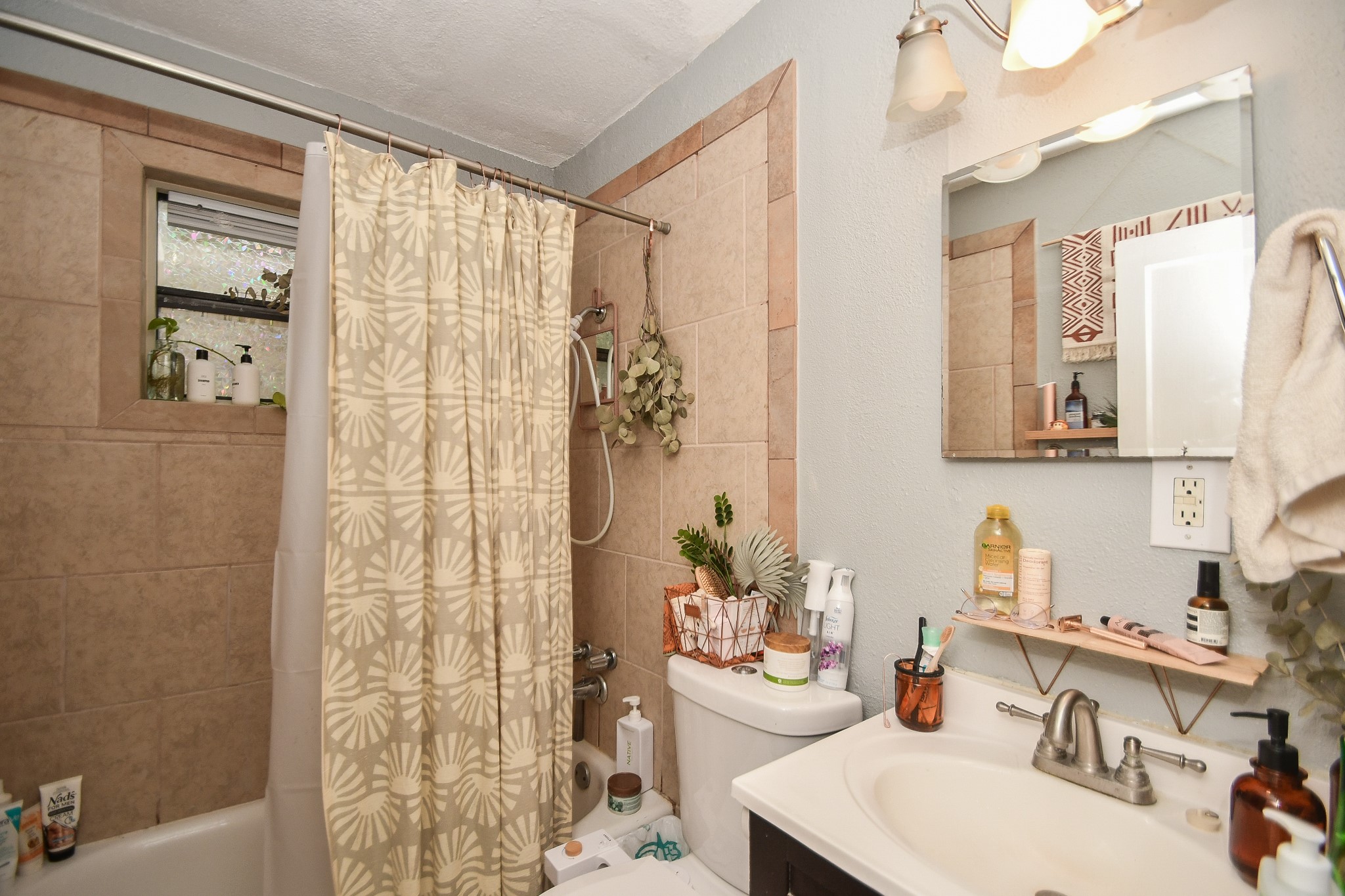 4623 Yupon Street, Unit 3 Houston, TX 77006 - Photo 14 of 18 a bathroom with a sink mirror and shower