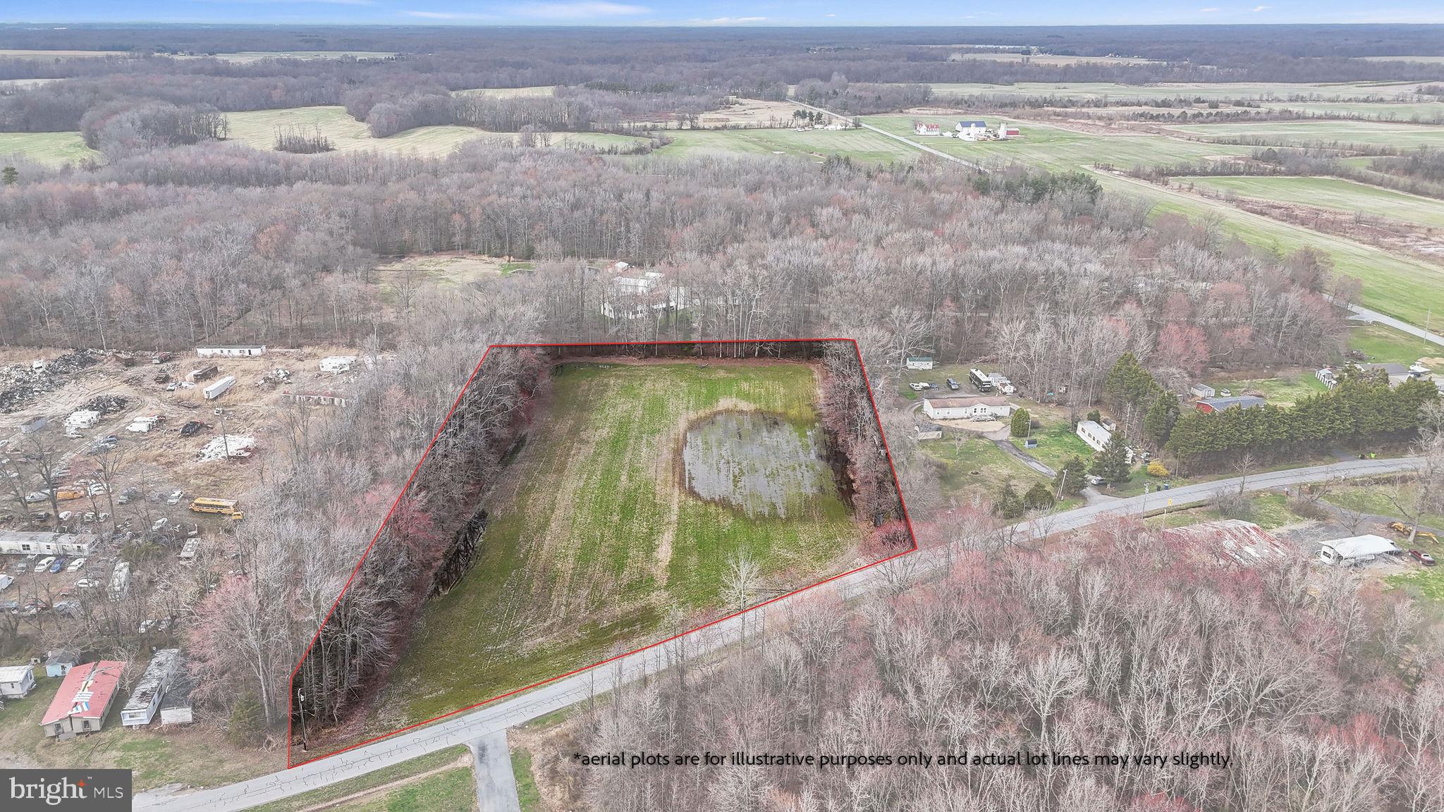 Expansive wooded lot awaits your vision.