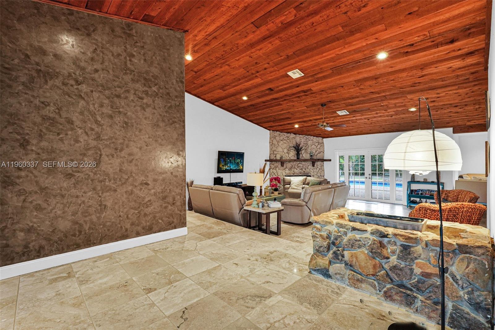 5021 Southwest 168th Avenue Southwest Ranches, FL 33331 - Photo 12 of 88 a view of a patio with couches and chairs with wooden floor