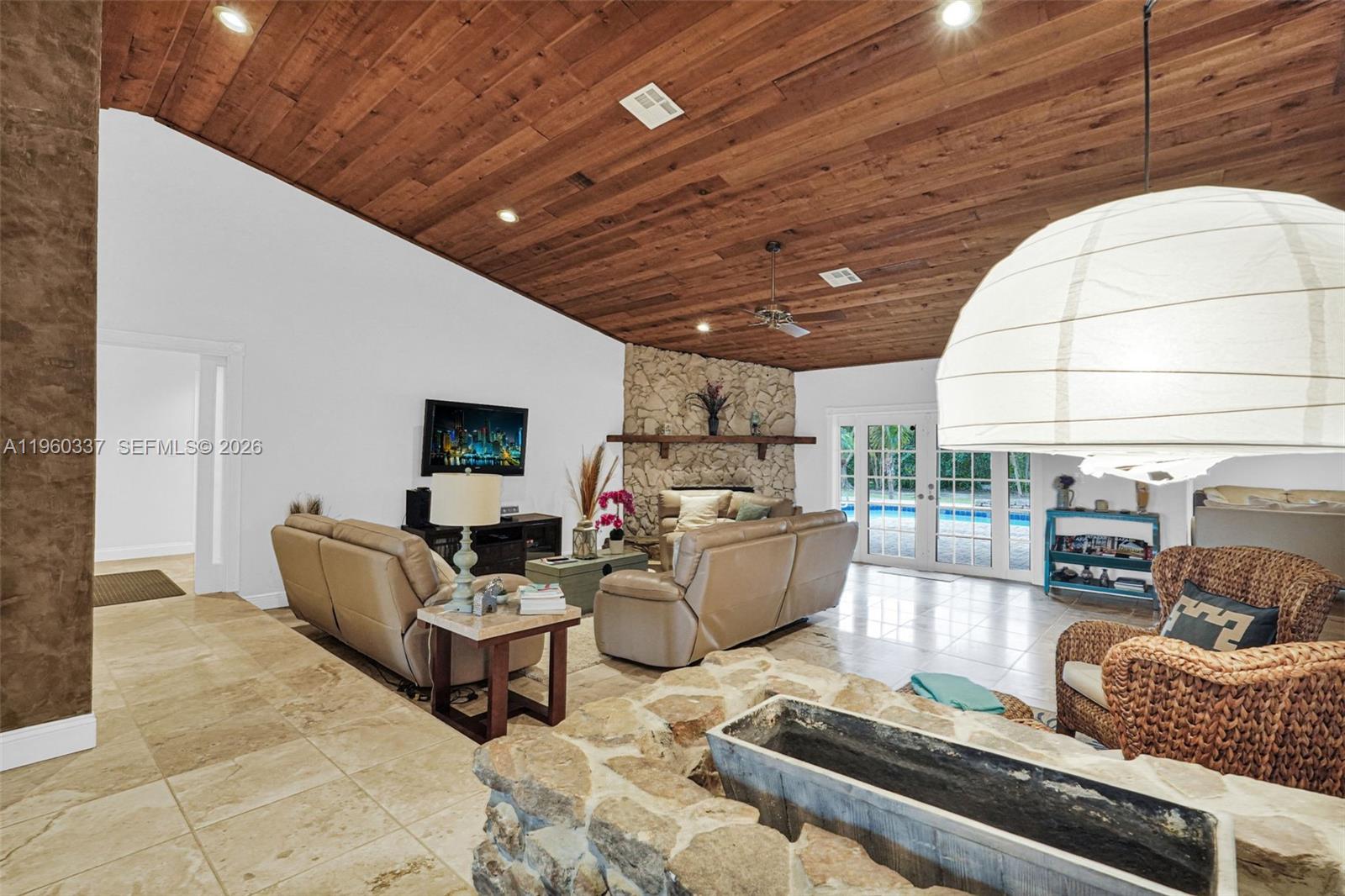 5021 Southwest 168th Avenue Southwest Ranches, FL 33331 - Photo 14 of 88 a living room with furniture and a table