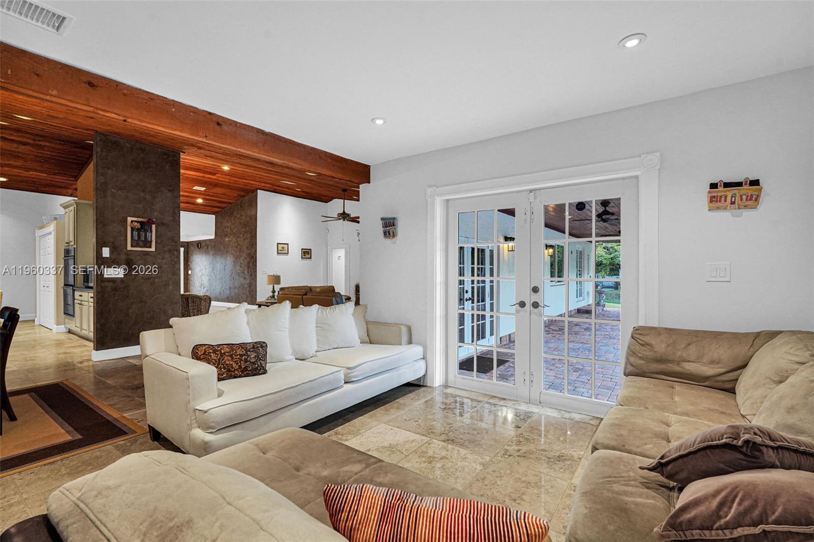 5021 Southwest 168th Avenue Southwest Ranches, FL 33331 - Photo 15 of 88 a living room with furniture and a large window