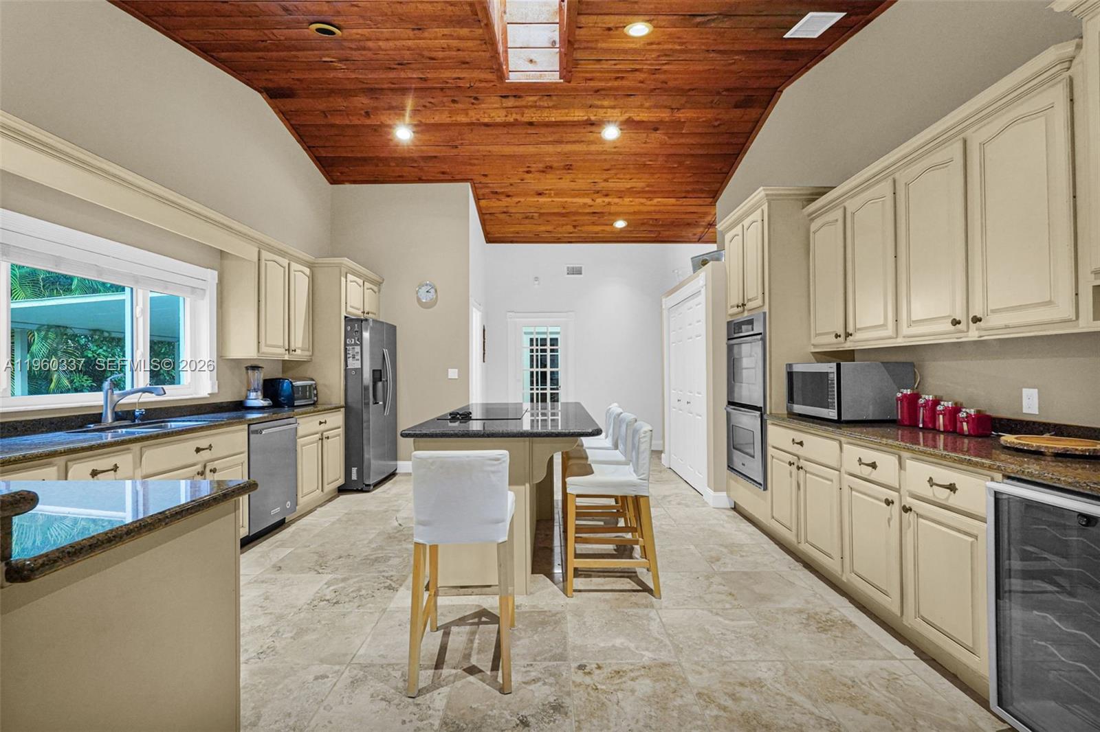 5021 Southwest 168th Avenue Southwest Ranches, FL 33331 - Photo 17 of 88 a kitchen with stainless steel appliances kitchen island granite countertop a sink and cabinets