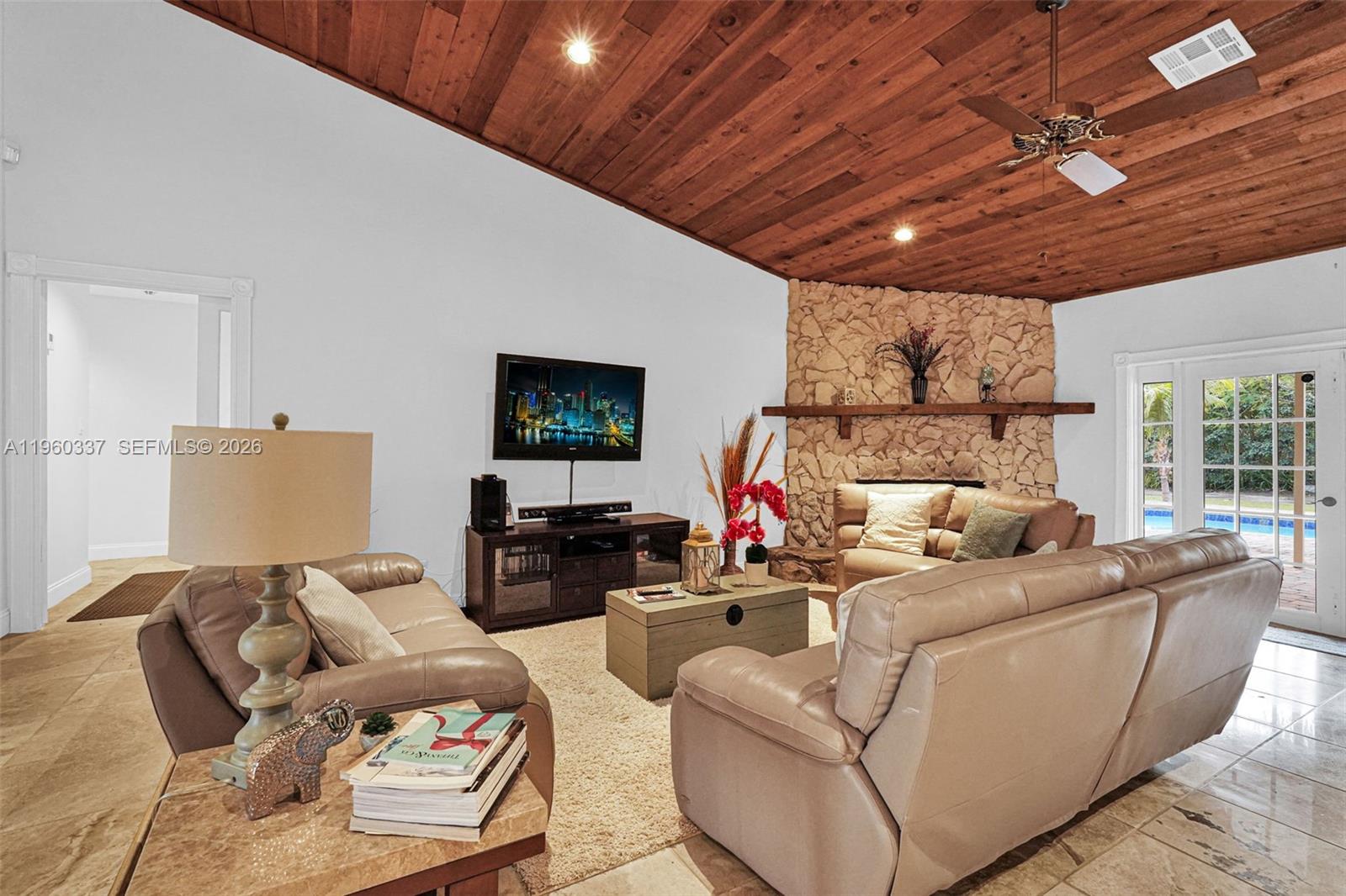 5021 Southwest 168th Avenue Southwest Ranches, FL 33331 - Photo 19 of 88 a living room with furniture and a flat screen tv