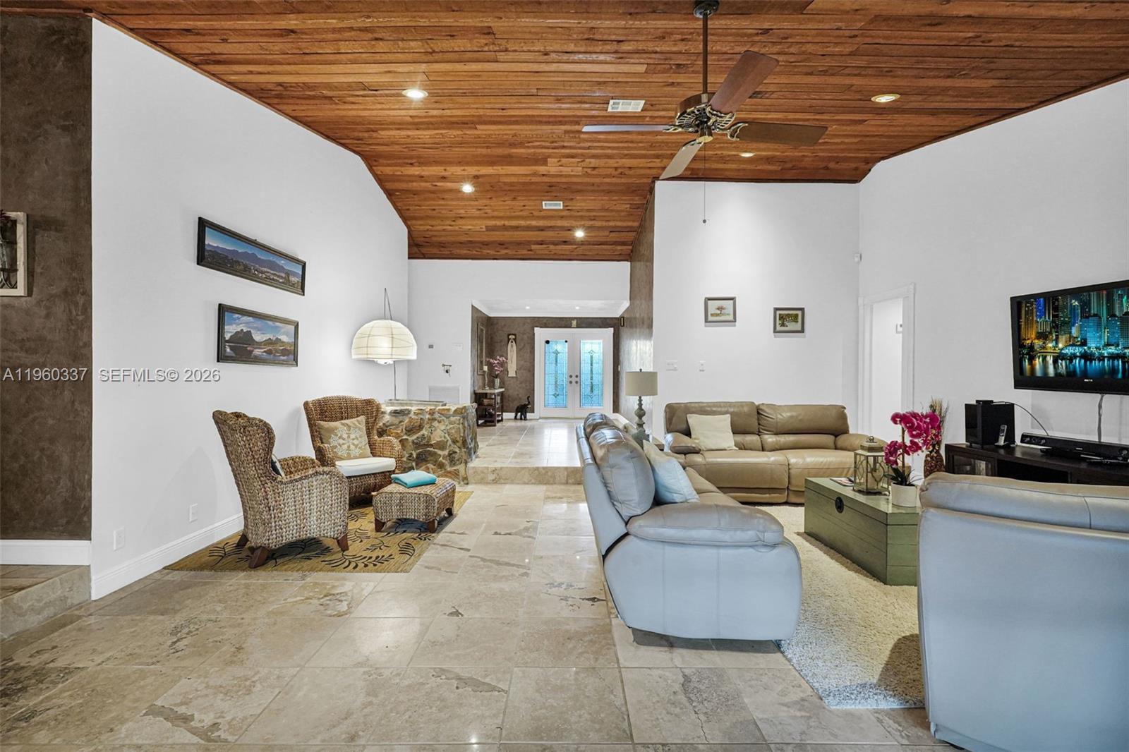 5021 Southwest 168th Avenue Southwest Ranches, FL 33331 - Photo 22 of 88 a living room with furniture and a flat screen tv
