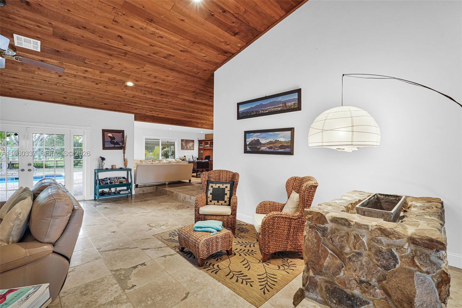 5021 Southwest 168th Avenue Southwest Ranches, FL 33331 - Photo 27 of 88 a living room with furniture and a chandelier