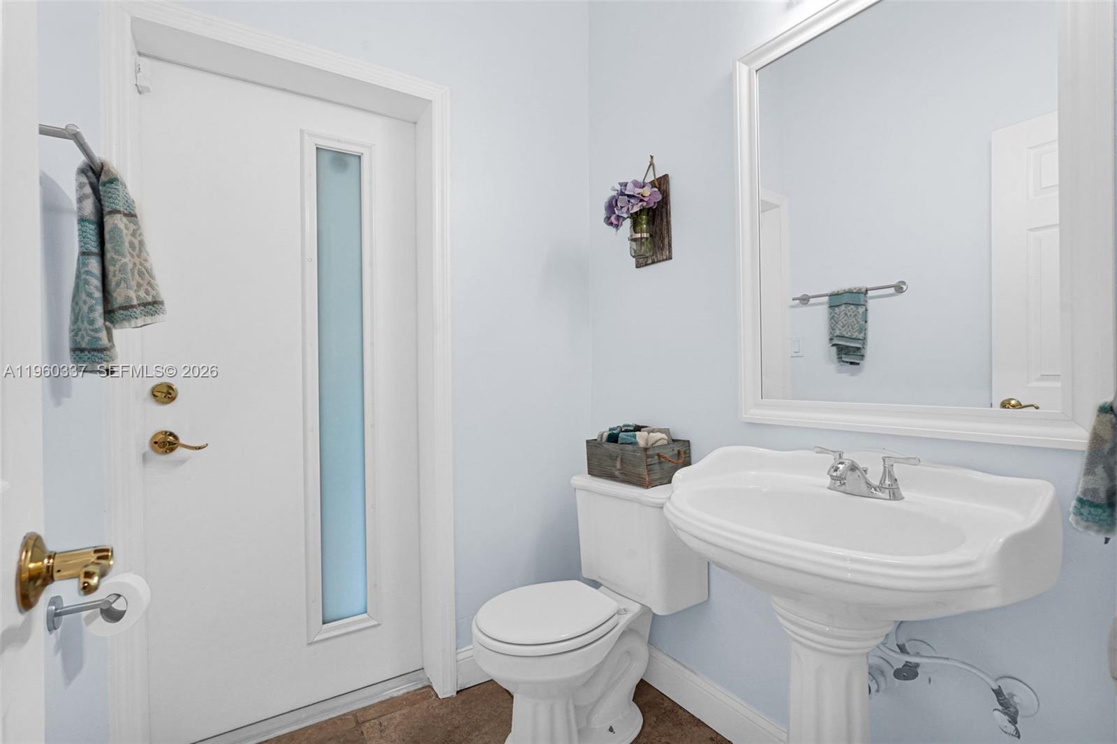 5021 Southwest 168th Avenue Southwest Ranches, FL 33331 - Photo 34 of 88 a bathroom with a sink toilet and a mirror