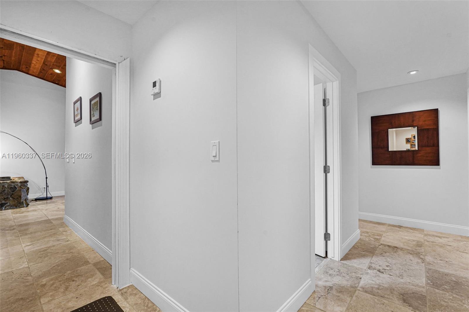 5021 Southwest 168th Avenue Southwest Ranches, FL 33331 - Photo 35 of 88 a view of a hallway with paintings on the wall