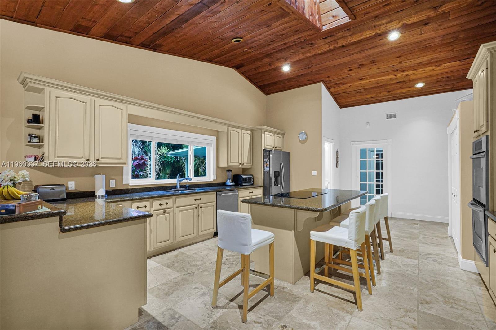 5021 Southwest 168th Avenue Southwest Ranches, FL 33331 - Photo 40 of 88 a kitchen with a sink and chairs