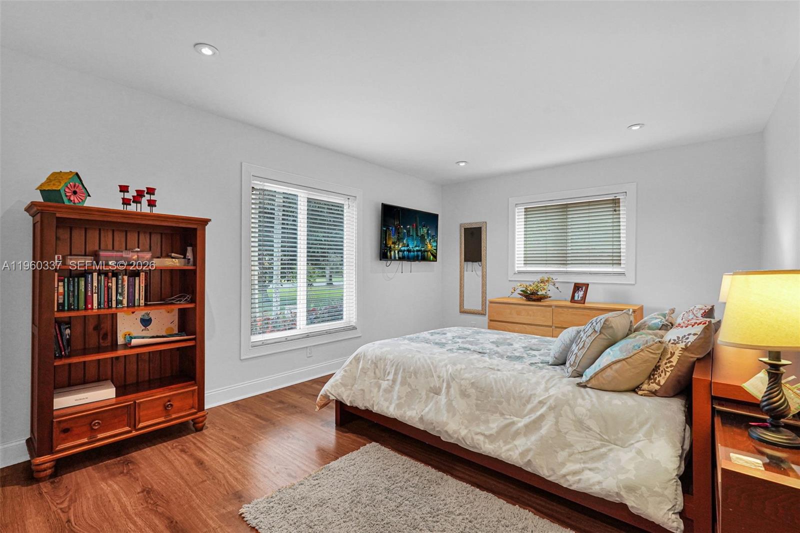 5021 Southwest 168th Avenue Southwest Ranches, FL 33331 - Photo 42 of 88 a bedroom with a bed and wooden floor