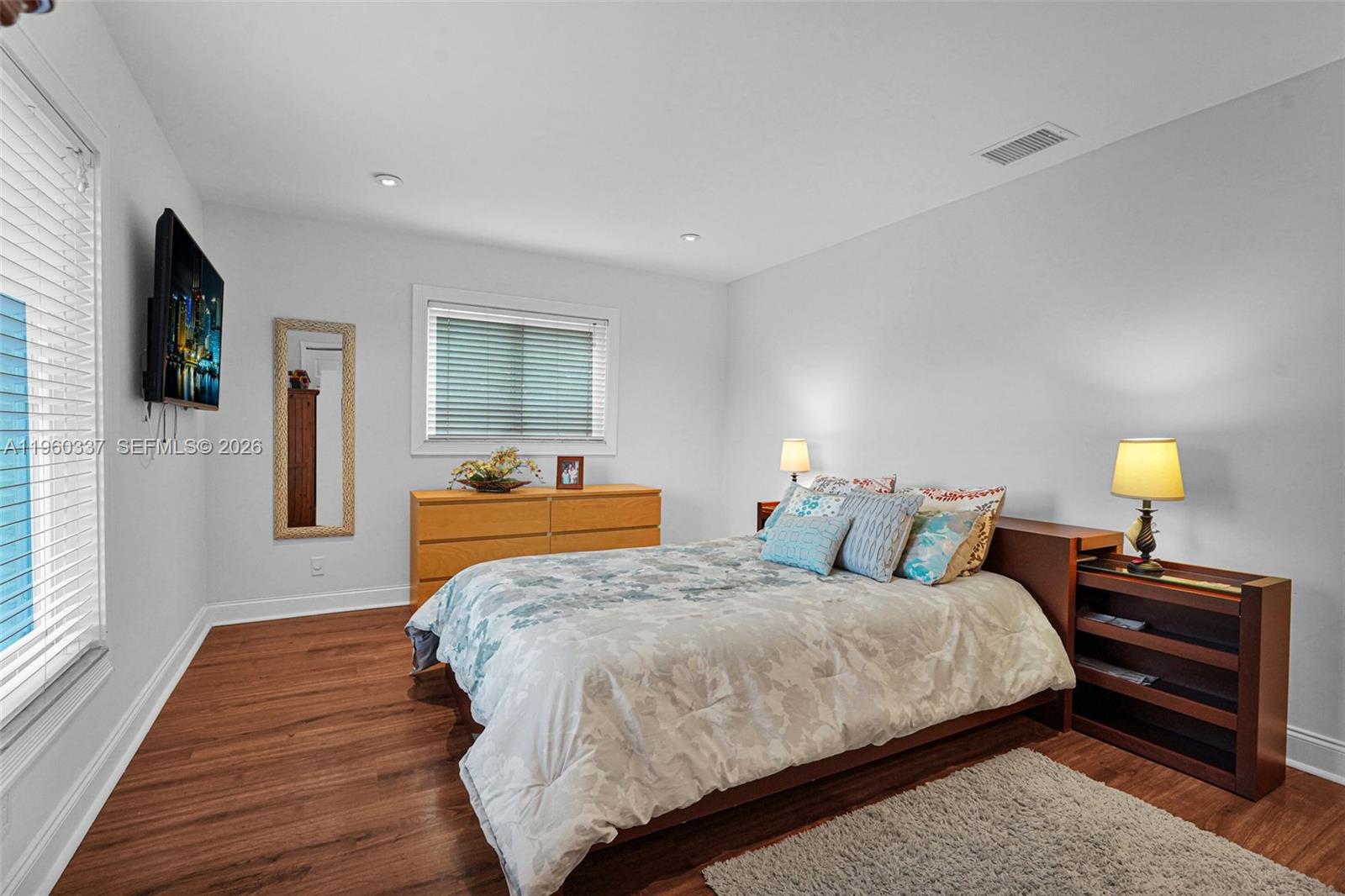 5021 Southwest 168th Avenue Southwest Ranches, FL 33331 - Photo 43 of 88 a bedroom with double bed and a flat tv screen on a dresser