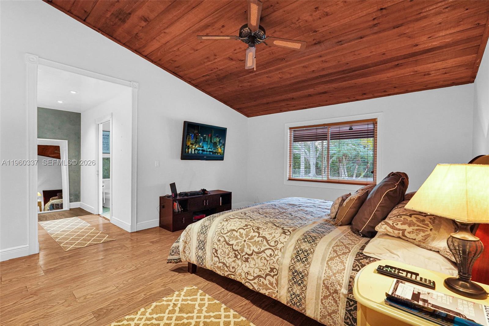 5021 Southwest 168th Avenue Southwest Ranches, FL 33331 - Photo 50 of 88 a bedroom with a bed and wooden floor