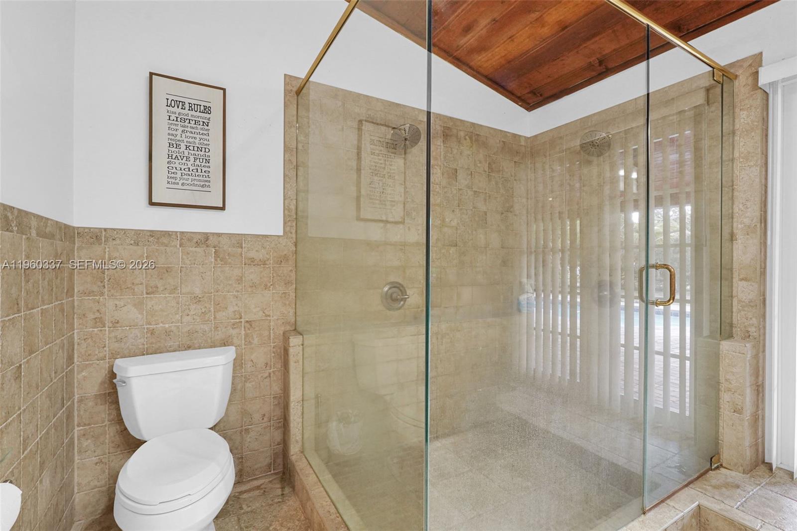 5021 Southwest 168th Avenue Southwest Ranches, FL 33331 - Photo 54 of 88 a bathroom with a toilet and shower