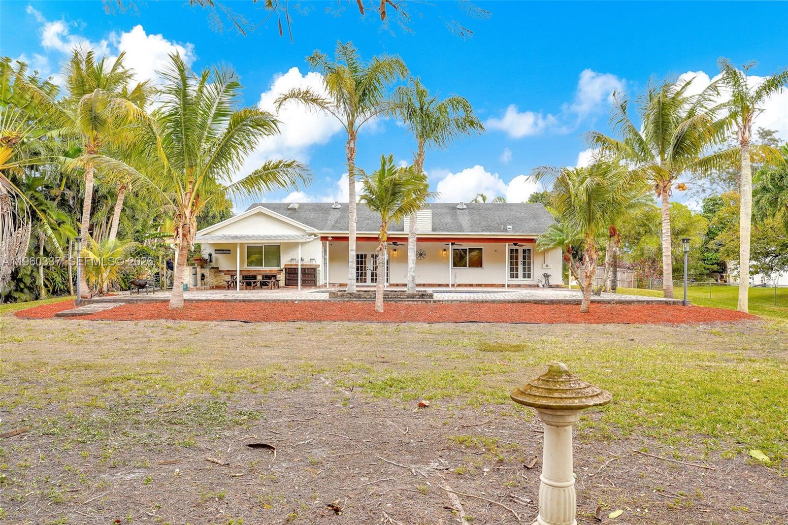 5021 Southwest 168th Avenue Southwest Ranches, FL 33331 - Photo 74 of 88 a front view of a house with swimming pool