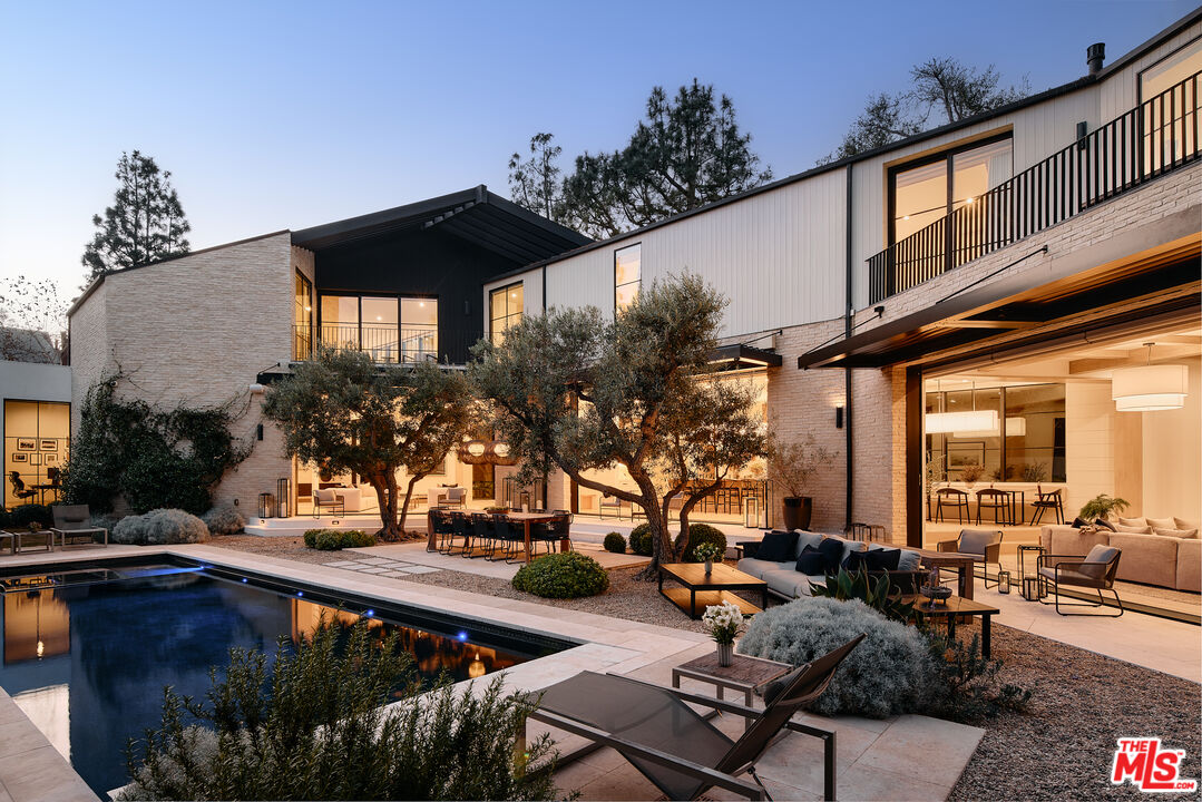 a view of a chairs and table in the patio