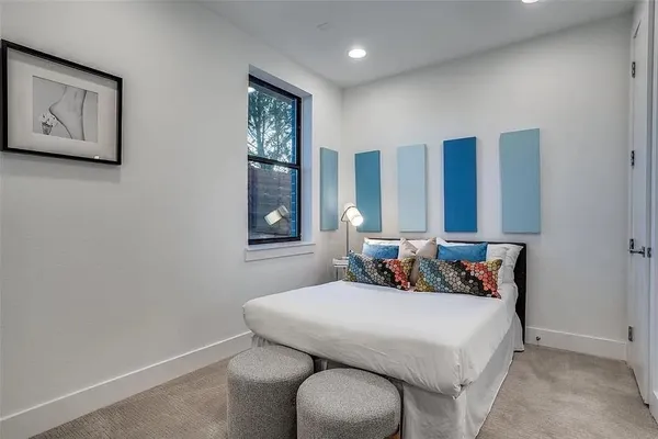 a bedroom with a bed and window