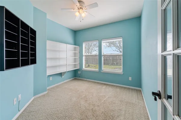 a view of an empty room with a window