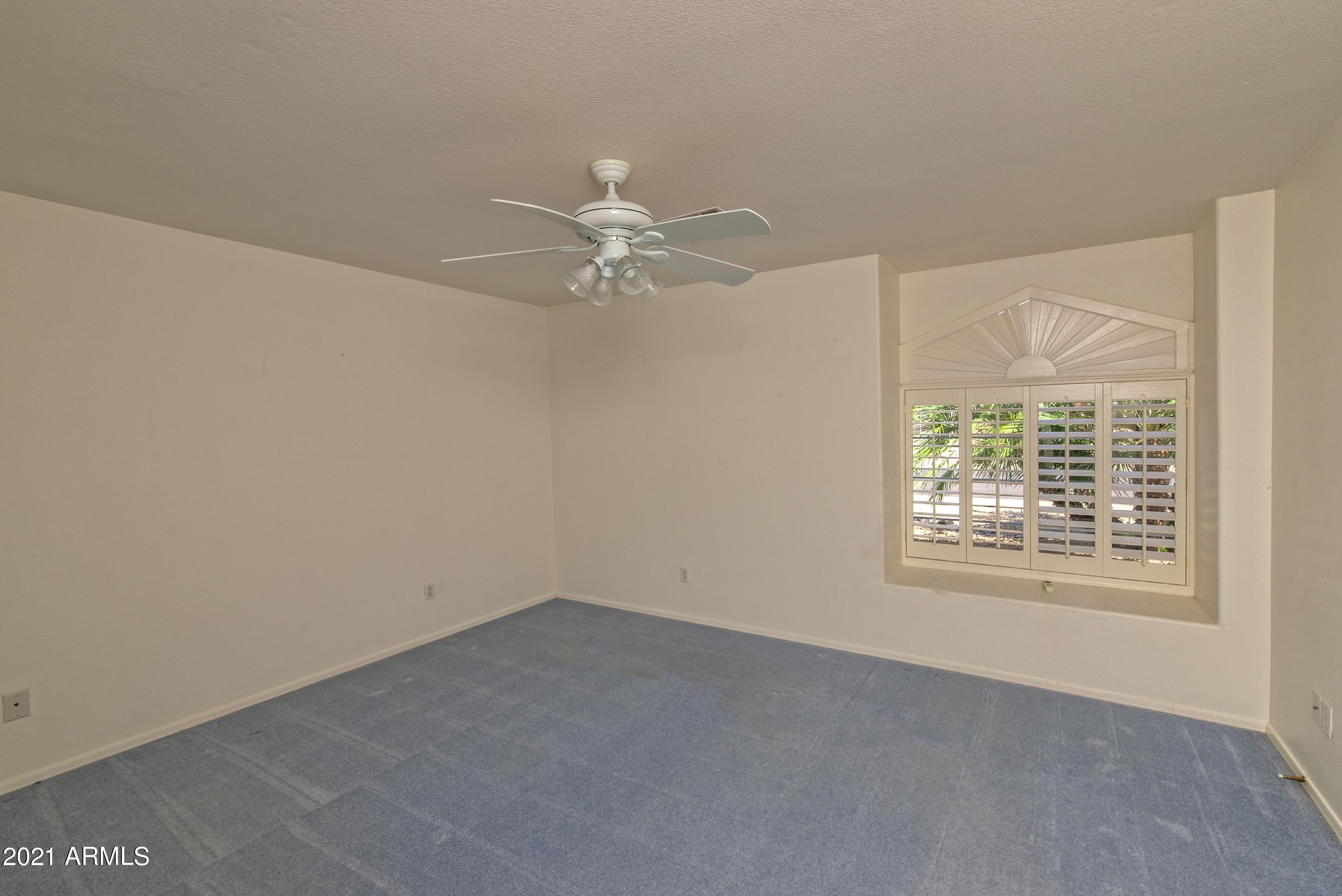 15561 Piccadilly Road Goodyear, AZ 85395 - Photo 13 of 22 013_Guest Bedroom