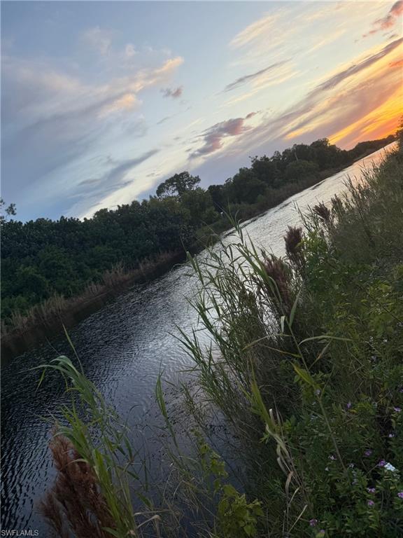 66th Street Southwest Naples, FL 34105 - Photo 4 of 9 a view of mountain with lake view