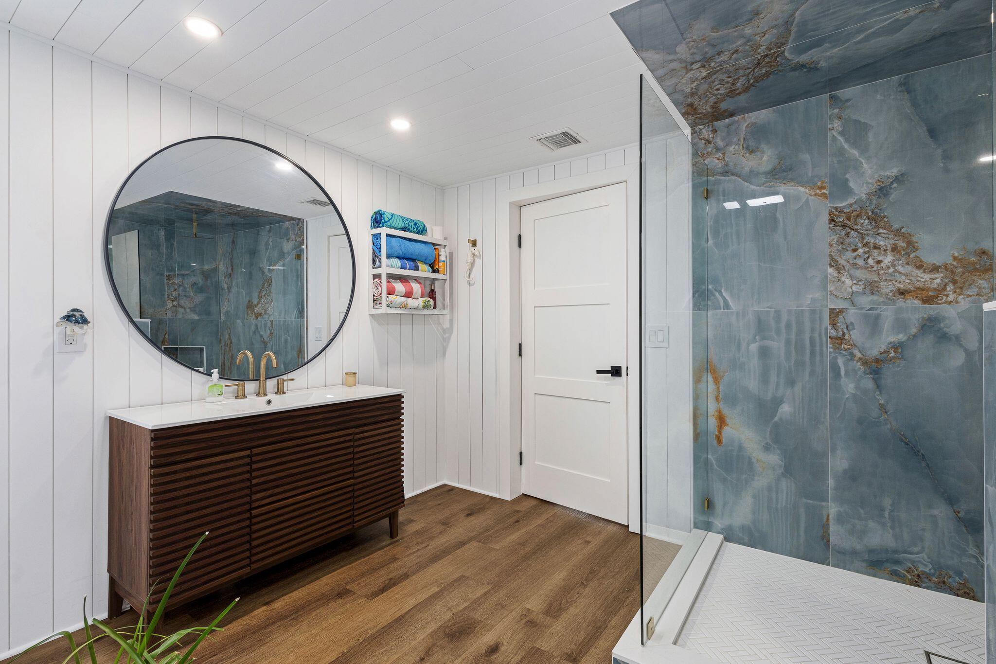226 Bamboo Road Palm Beach Shores, FL 33404 - Photo 18 of 39 a bathroom with a sink and a mirror