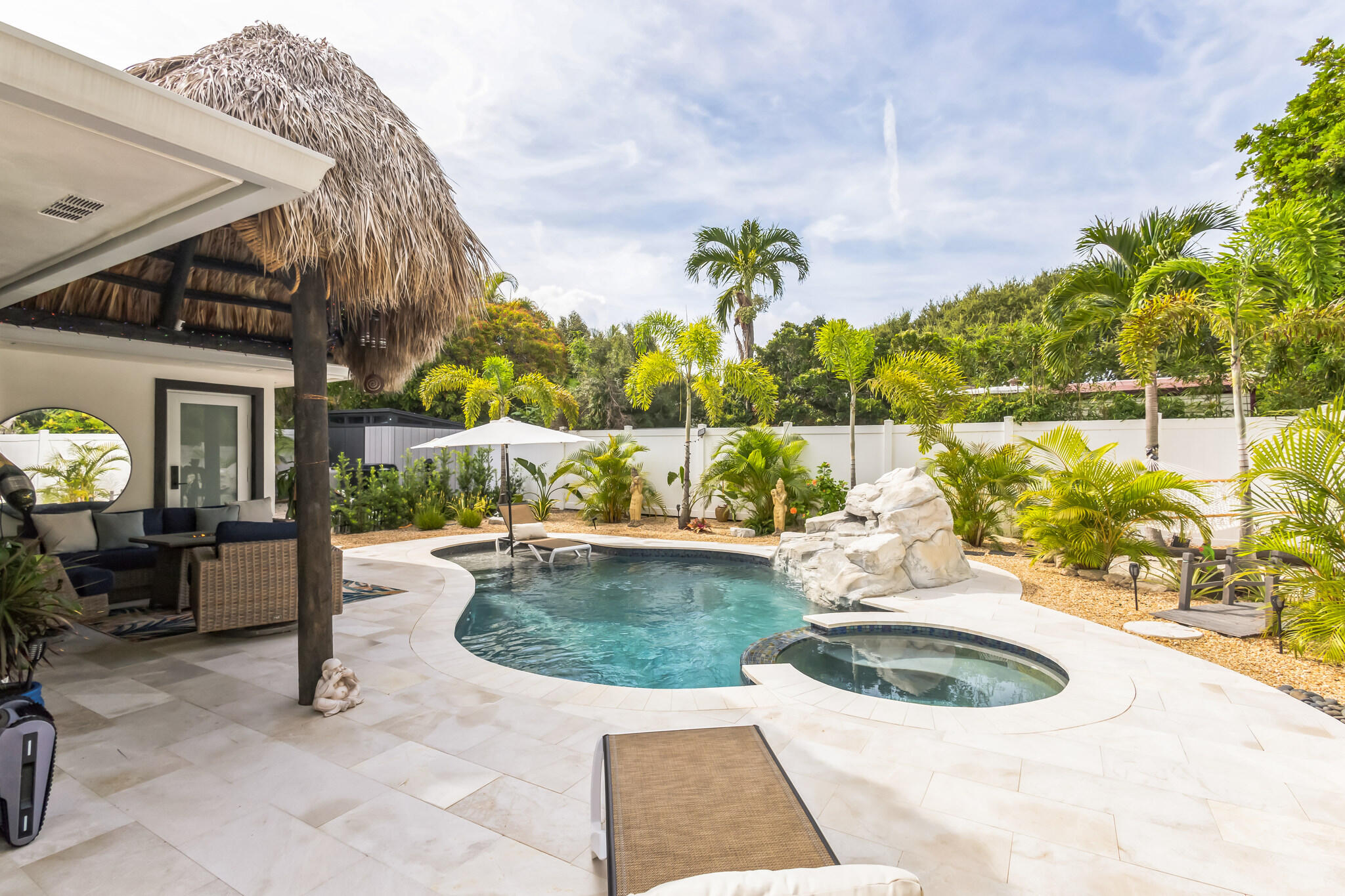 226 Bamboo Road Palm Beach Shores, FL 33404 - Photo 25 of 39 a view of a swimming pool with a patio