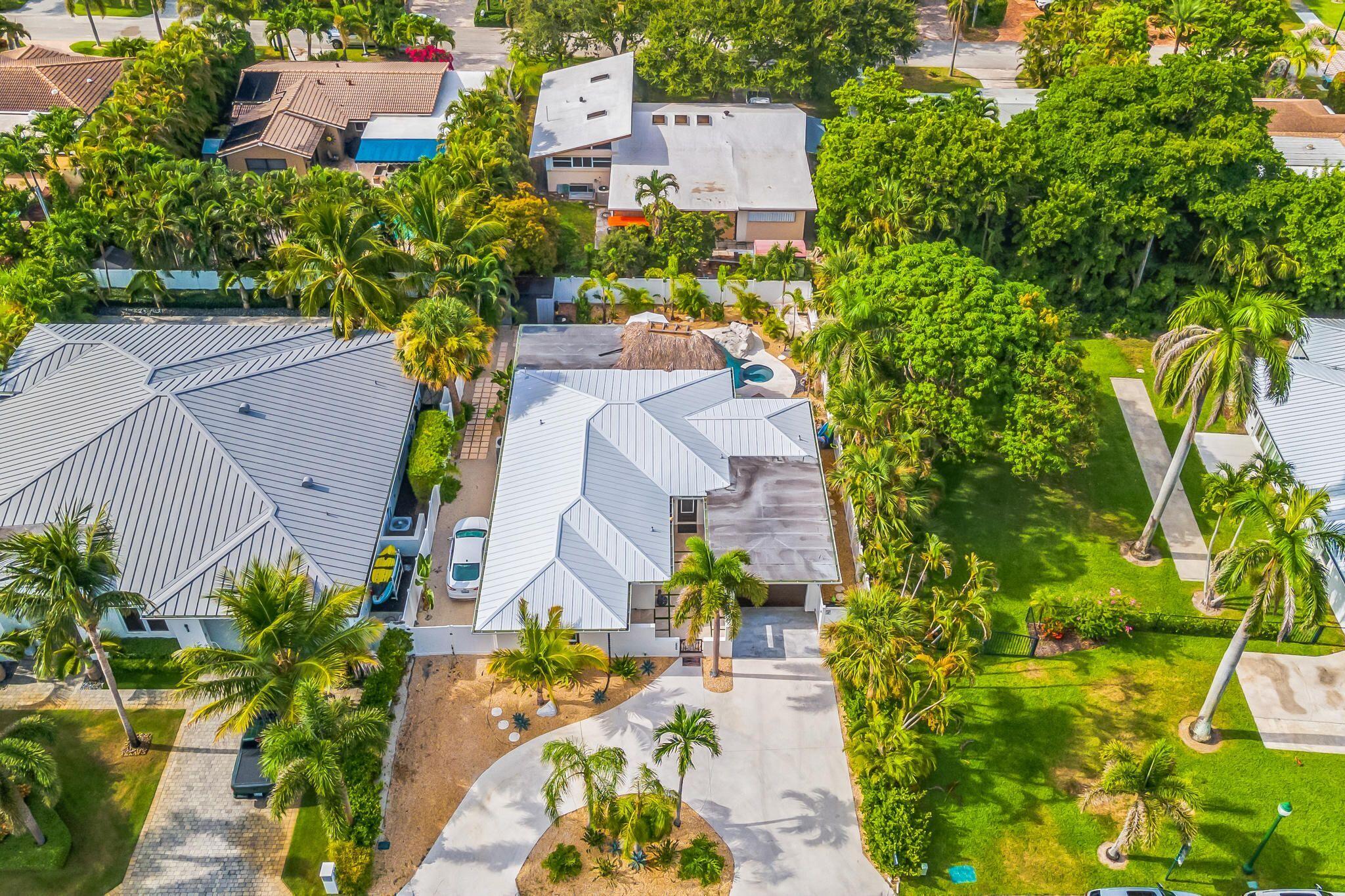 226 Bamboo Road Palm Beach Shores, FL 33404 - Photo 27 of 39 an aerial view of a house with a yard and garden