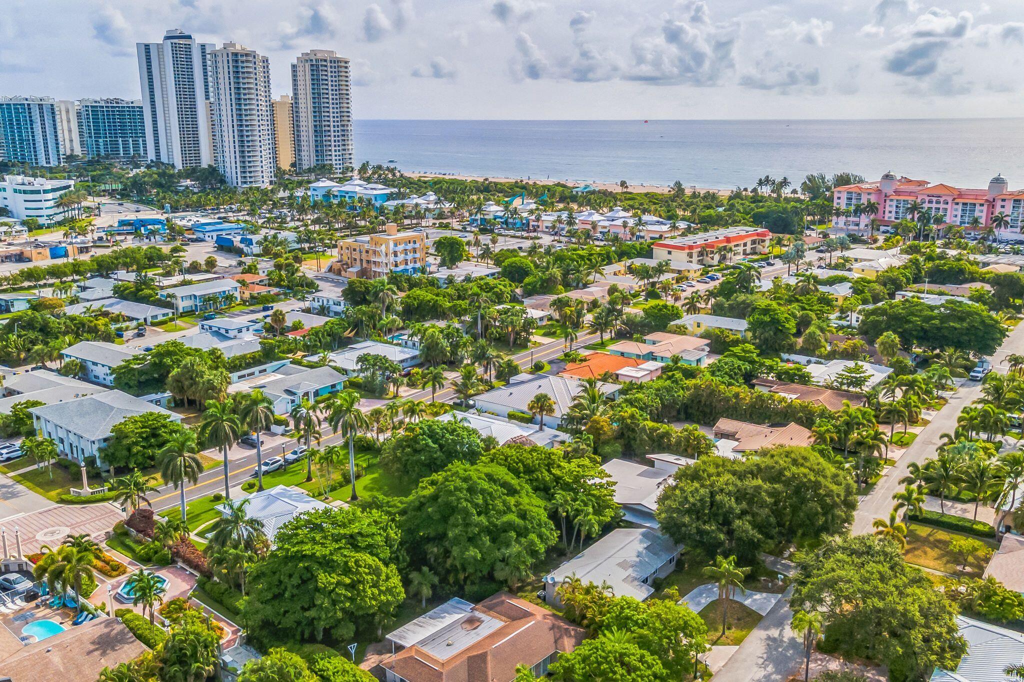 226 Bamboo Road Palm Beach Shores, FL 33404 - Photo 38 of 39 a view of a city with lush green forest