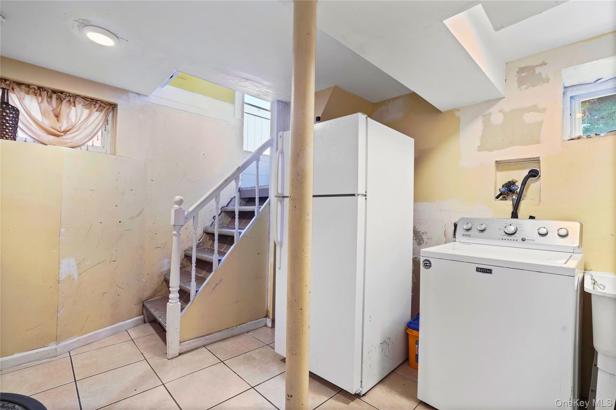 59-11 Fresh Pond Road Queens, NY 11378 - Photo 8 of 18 a view of hallway with washer and dryer