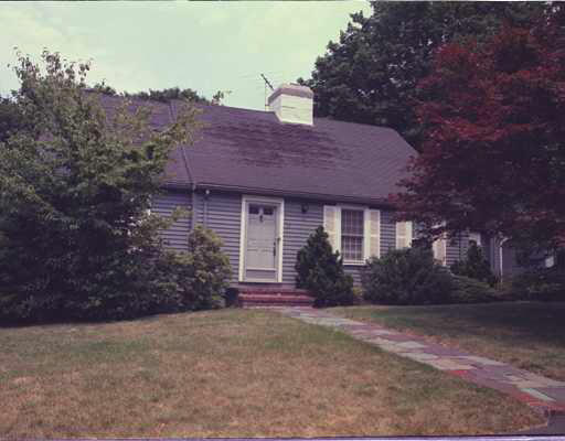 17 Puritan Road Newton, MA 02461 - Photo 1 of 1 a front view of a house with a garden