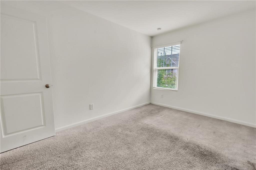 1517 Vernon Boulevard Decatur, GA 30035 - Photo 11 of 25 a view of an empty room with a window