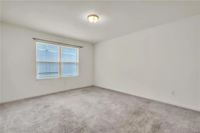 a view of an empty room and entryway