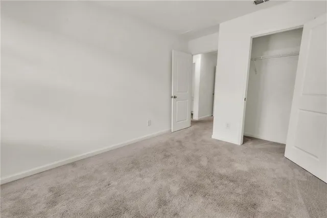 a view of an empty room and entryway