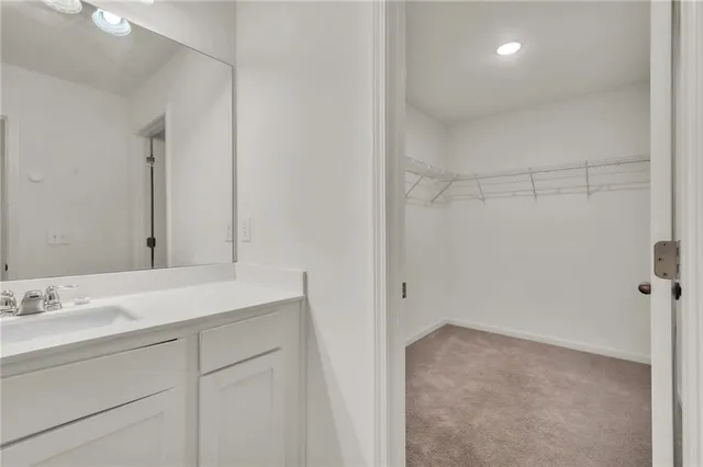 a bathroom with a toilet a sink and a shower