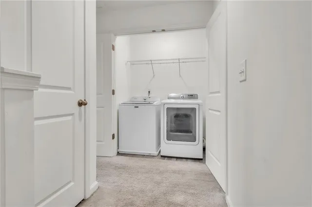 a front view of a house with yard and parking space