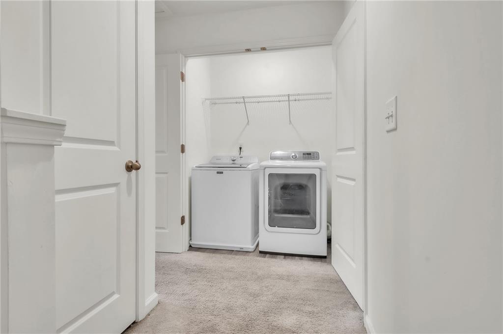 1517 Vernon Boulevard Decatur, GA 30035 - Photo 23 of 25 a view of a storage and utility room with washer and dryer