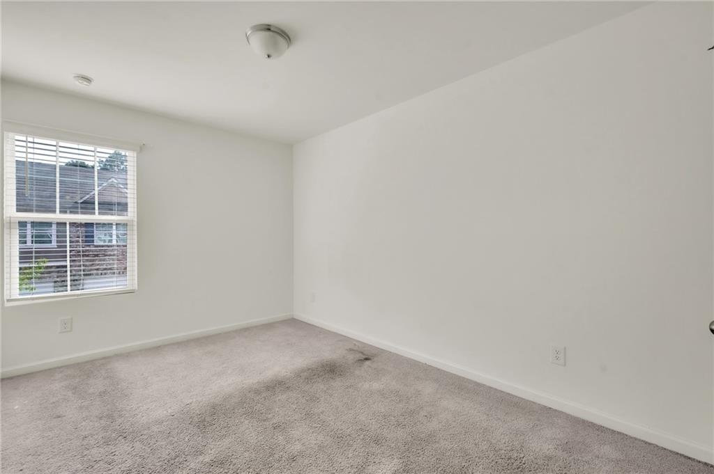 1517 Vernon Boulevard Decatur, GA 30035 - Photo 10 of 25 an empty room with a window