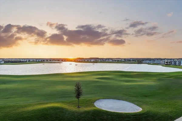 a view of a building with car parked
