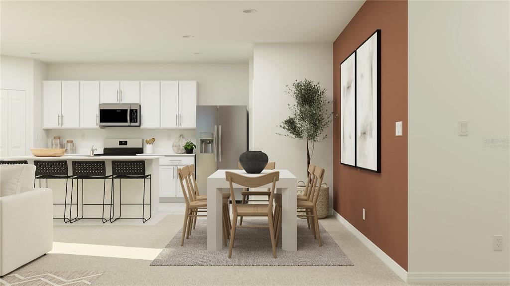 2142 Lasso Loop Eagle Lake, FL 33839 - Photo 3 of 31 a kitchen with granite countertop a table and chairs in it