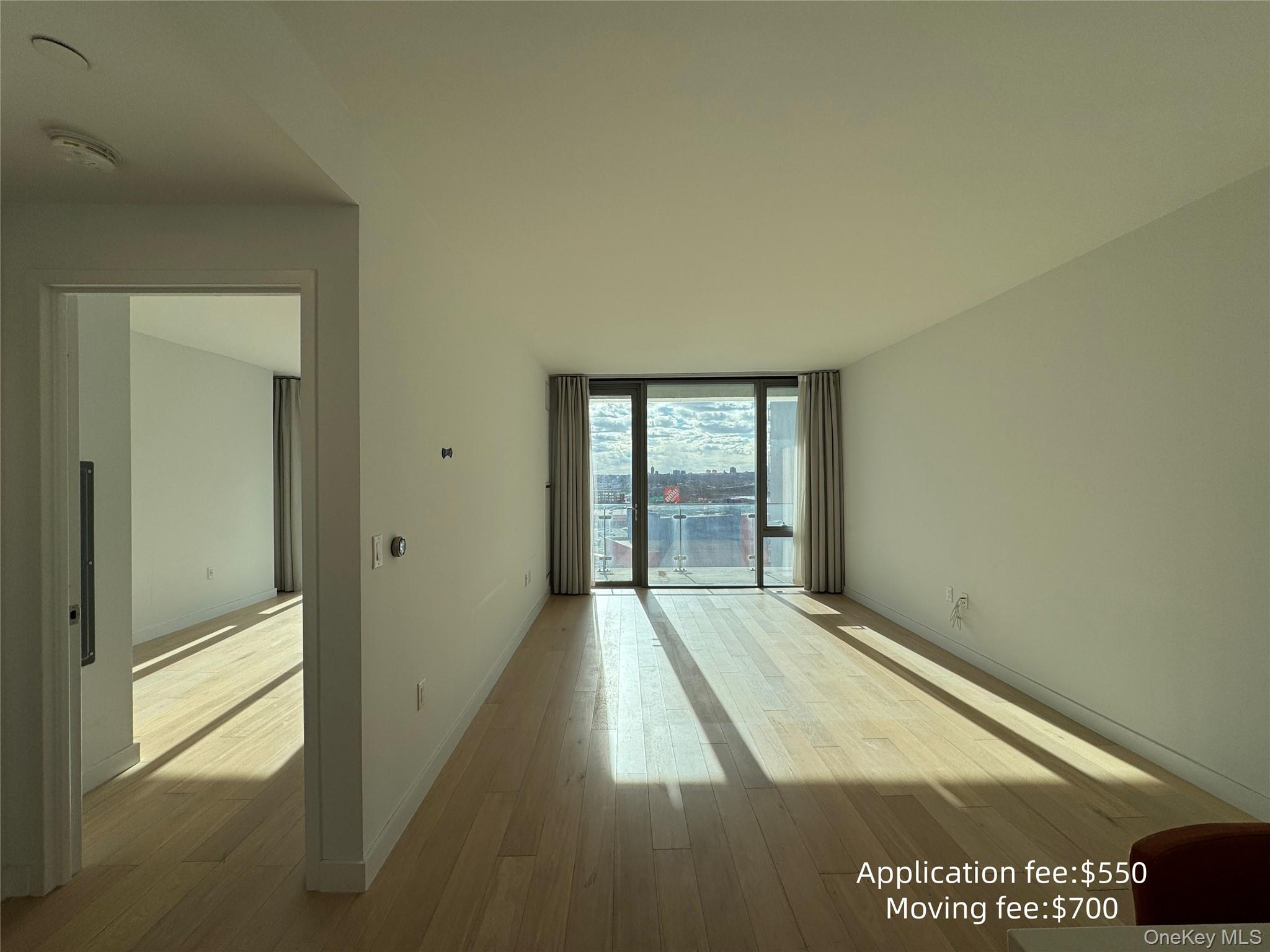 131-01 40 Road, Unit 16T Queens, NY 11354 - Photo 5 of 14 a view of an empty room and window