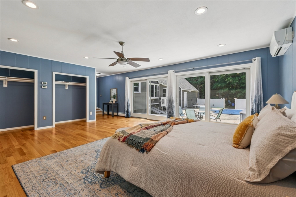 19 Cross Road Boxford, MA 01921 - Photo 2 of 41 a bedroom with a large bed and large windows