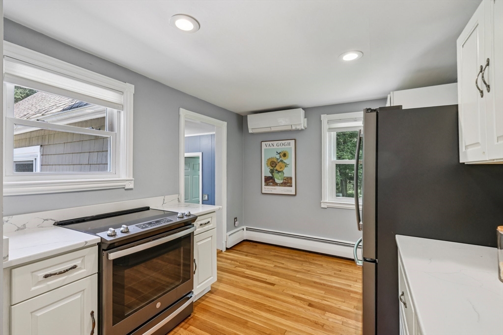 19 Cross Road Boxford, MA 01921 - Photo 22 of 41 a kitchen that has a stove and a wooden floor