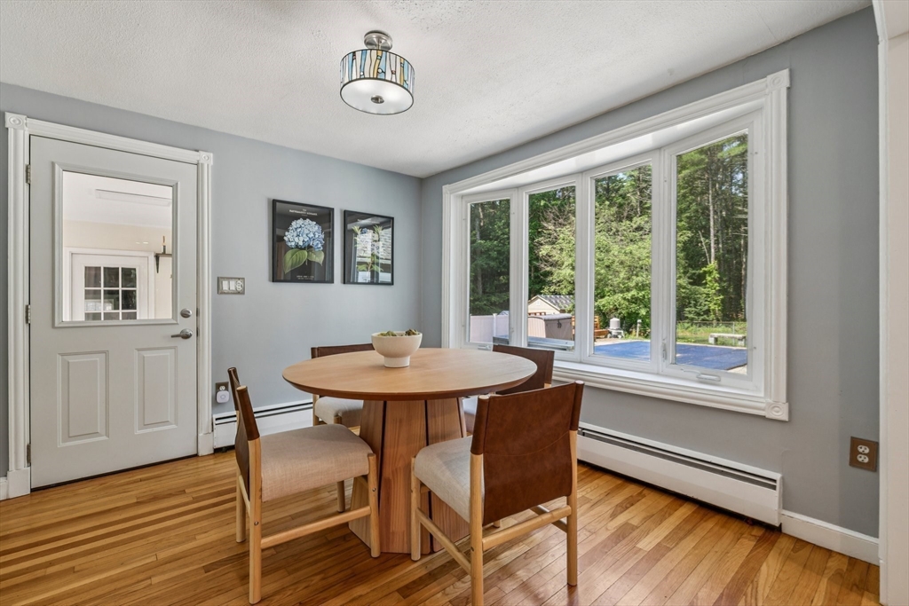 19 Cross Road Boxford, MA 01921 - Photo 24 of 41 a view of a dining room with furniture window and wooden floor