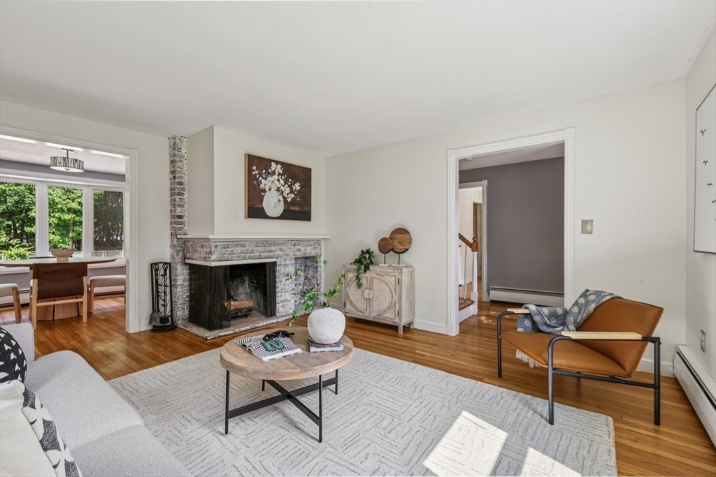 19 Cross Road Boxford, MA 01921 - Photo 26 of 41 a living room with furniture a flat screen tv and a fireplace