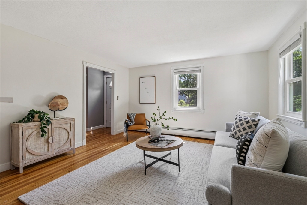 19 Cross Road Boxford, MA 01921 - Photo 27 of 41 a living room with furniture a rug and a window