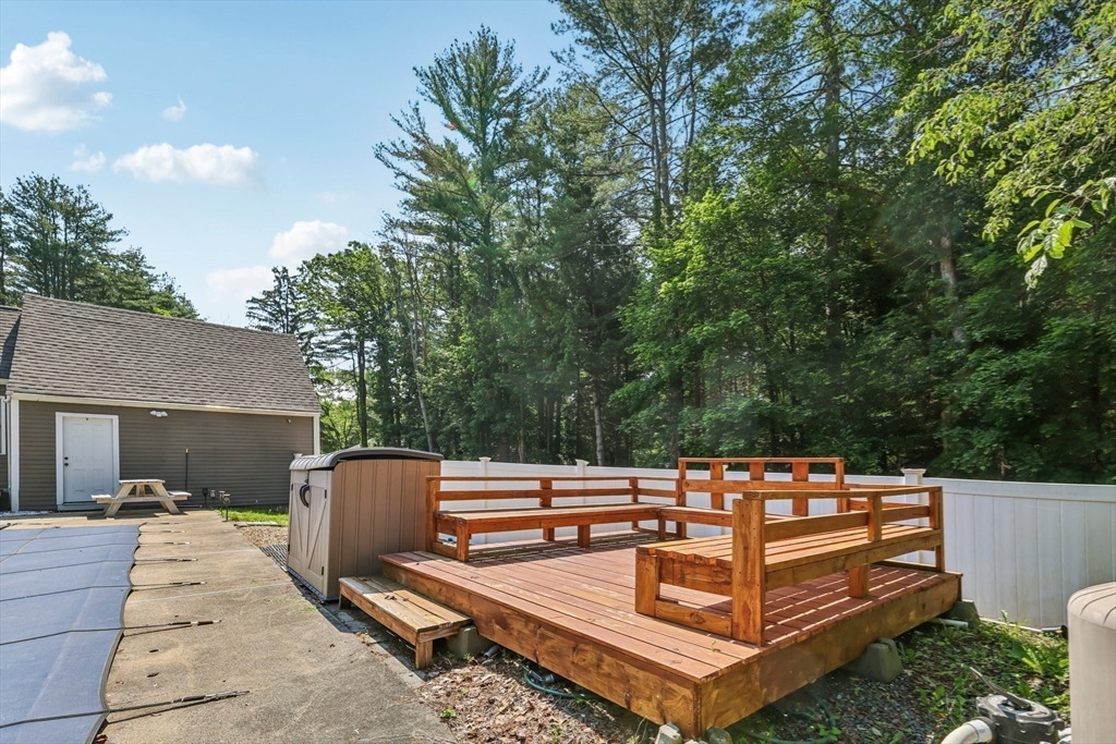 19 Cross Road Boxford, MA 01921 - Photo 31 of 41 a view of a chairs and tables in the back yard