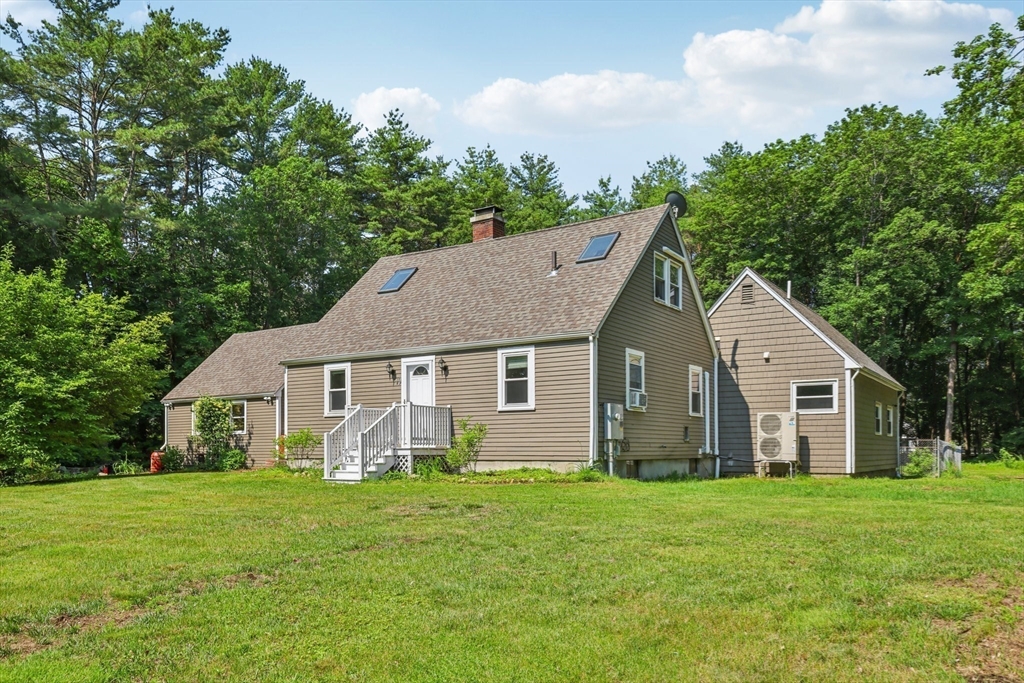 19 Cross Road Boxford, MA 01921 - Photo 36 of 41 a view of a house with backyard and garden