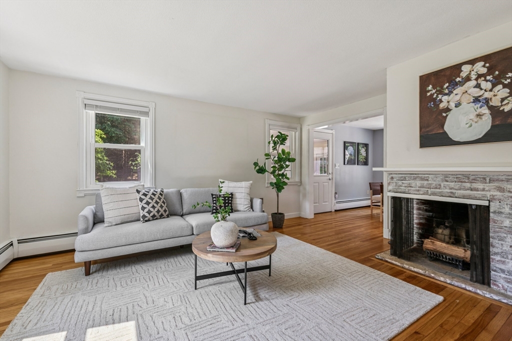 19 Cross Road Boxford, MA 01921 - Photo 4 of 41 a living room with furniture a fireplace and window