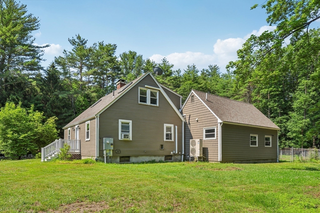 19 Cross Road Boxford, MA 01921 - Photo 41 of 41 a front view of a house with a yard and trees